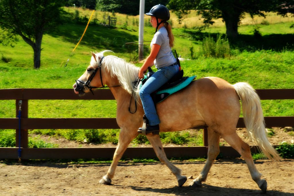 Perri and Benny horseback riding at East Hill Farm
