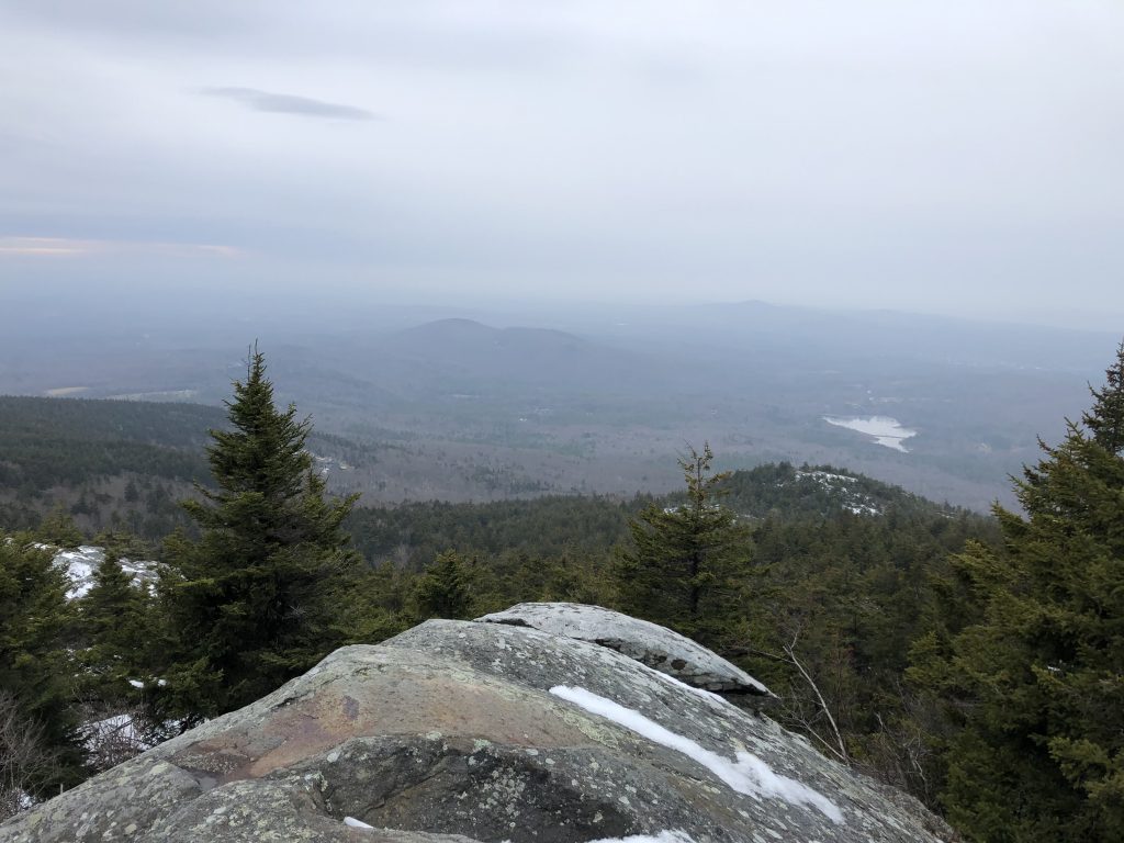view of east hill farm from mt monadnock in the winter on a cloudy day