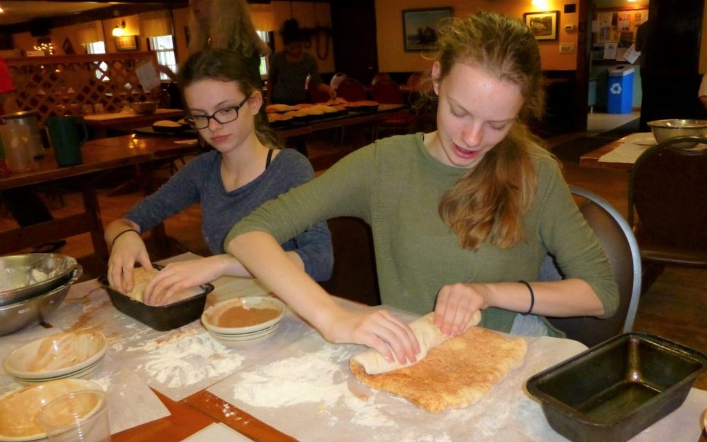 students at east hill farm school making bread