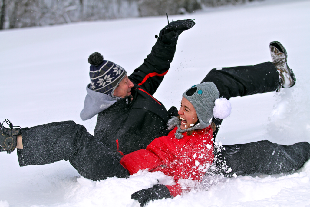 adults sledding fun at east hill farm